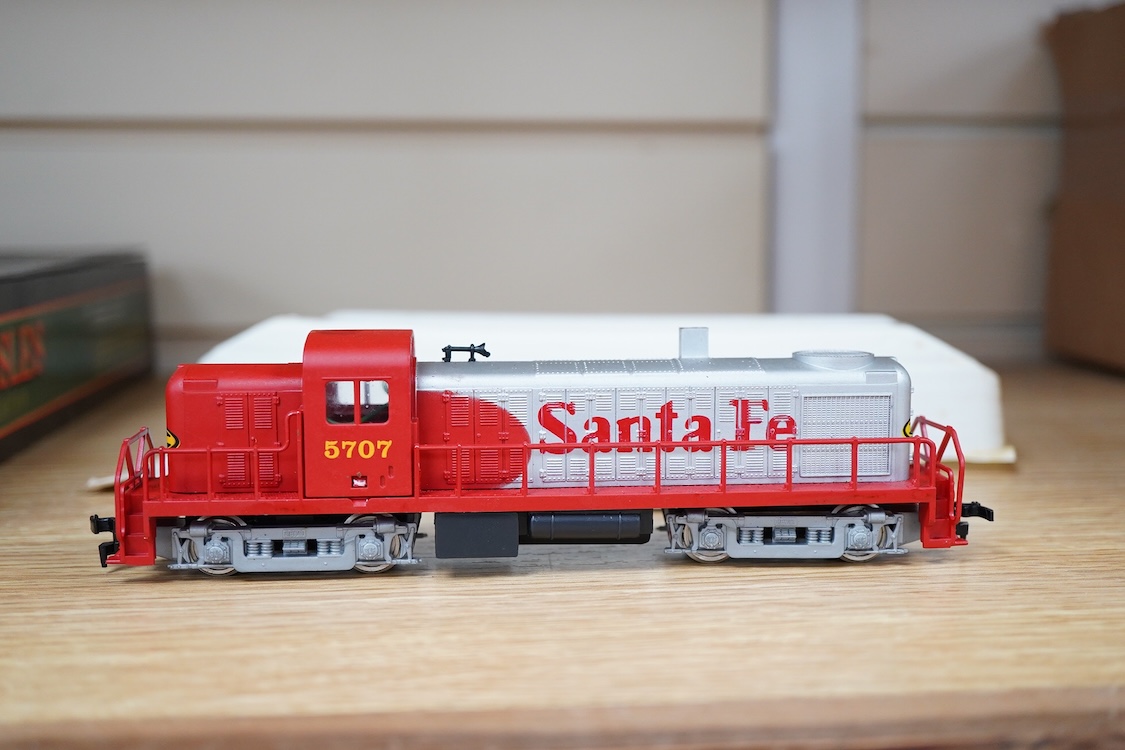 A quantity of US outline HO railway by Athearn, Bachmann, etc. including three locomotives; a Union Pacific Bo-Bo diesel, 1468, a Santa Fe Bo-Bo diesel, 5707, and a Santa Fe 0-4-0 tender engine, together with a 12-wheel